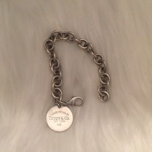 Tiffany 925 chain link bracelet with round charm.